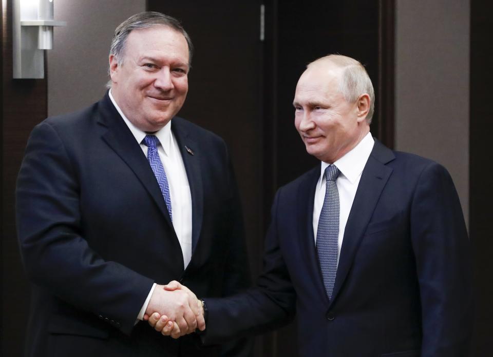 Russian President Vladimir Putin, right, and U.S. Secretary of State Mike Pompeo, pose for a photo prior to their talks in the Black Sea resort city of Sochi, southern Russia, Tuesday, May 14, 2019. Pompeo arrived in Russia for talks that are expected to focus on an array of issues including arms control and Iran. (AP Photo/Pavel Golovkin, Pool)