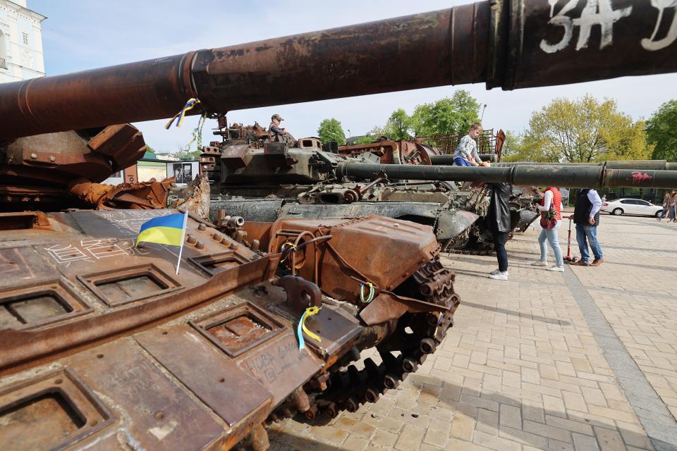 People come to look at an exhibition displaying destroyed Russian military vehicles in central Kyiv, Ukraine, on Wednesday, May 3, 2023. | Scott G Winterton, Deseret News