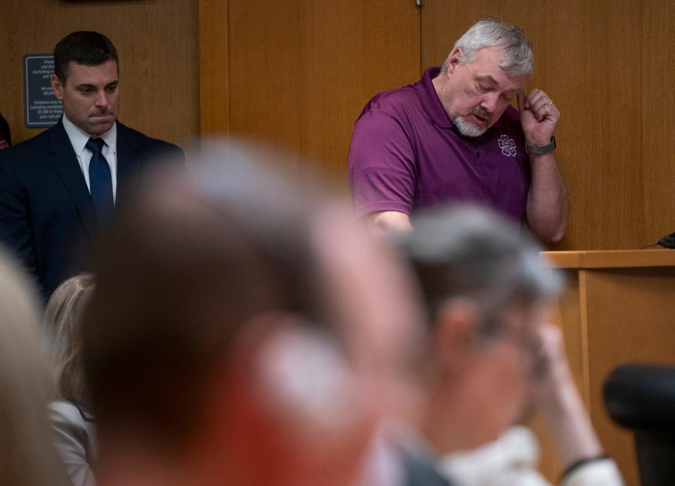 Assistant Oakland County Prosecutor Marc Keast stands left while Steve St. Juliana makes a victim statement about losing his daughter Hana St. Juliana during the 2021 Oxford High School shooting before James and Jennifer Crumbley, the shooters' parents, are sentenced by Oakland County Judge Cheryl Matthews on Tuesday, April 9, 2024. The Crumbleys were both found guilty on four counts of involuntary manslaughter.