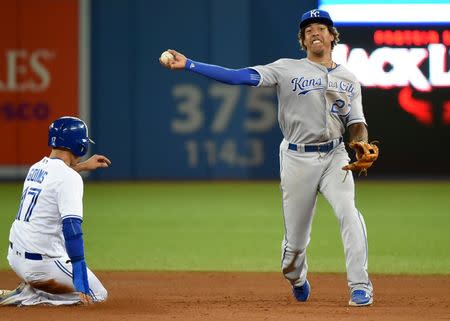 Sep 20, 2017; Toronto, Ontario, CAN; Kansas City Royals shortstop Raul Mondesi (27) throws to first base but cannot turn a double play after forcing Toronto Blue Jays shortstop Ryan Goins (17) in the ninth inning at Rogers Centre. Mandatory Credit: Dan Hamilton-USA TODAY Sports