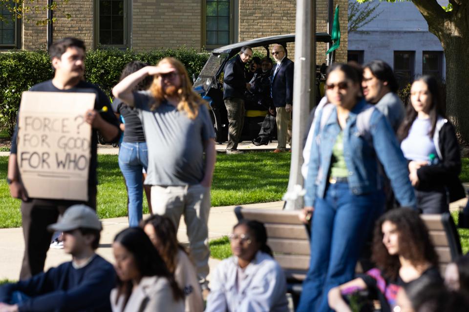 Notre Dame Police watch from afar during a pro-Palestinian protest on the University of Notre Dame's campus on Thursday, April 25, 2024. The police would later leave after tearing down tents that were put up by the protesters.