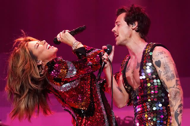 <p>Kevin Mazur/Getty</p> Shania Twain and Harry Styles perform onstage at the Coachella Stage during the 2022 Coachella Valley Music And Arts Festival on April 15, 2022 in Indio, Cali.