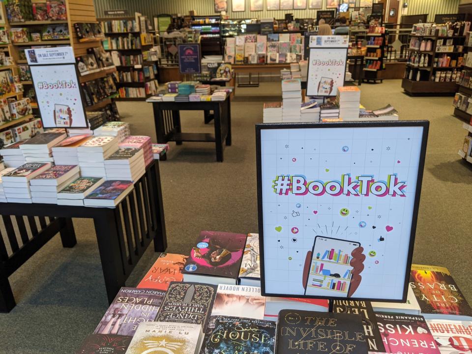 A table displays signs with #BookTok, at a Barnes and Noble in  Scottsdale, Ariz., Thursday, Sept. 2, 2021.  TikTok, an app best known for dancing videos with 1 billion users worldwide, has also become a shopping phenomenon. National chains are setting up TikTok sections. (AP Photo/Tali Arbel)