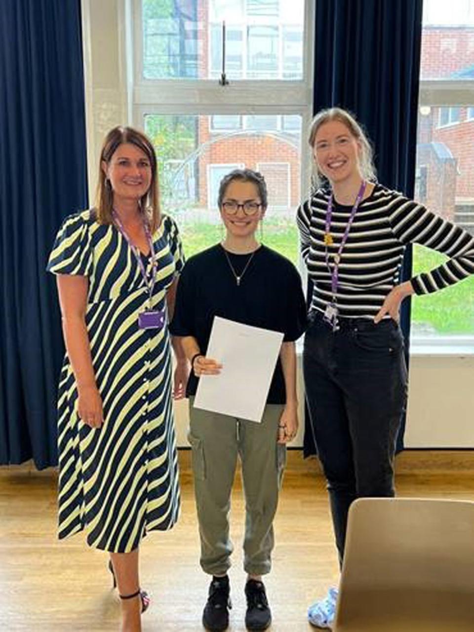 Rhiannon Craig picking up her A-level results at Chepstow School with acting head teacher of Kelly Bowd (left), and phase progress leader Sarah Harris (right) (Chepstow School/PA) (PA Media)