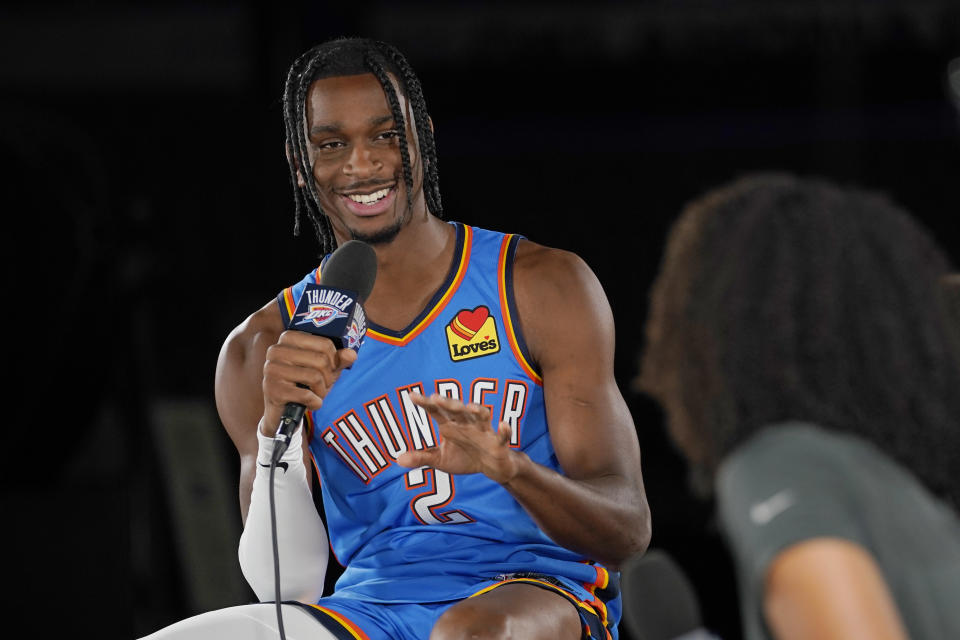 Oklahoma City Thunder guard Shai Gilgeous-Alexander (2) is interviewed during an NBA basketball media day Monday, Sept. 26, 2022, in Oklahoma City. (AP Photo/Sue Ogrocki)