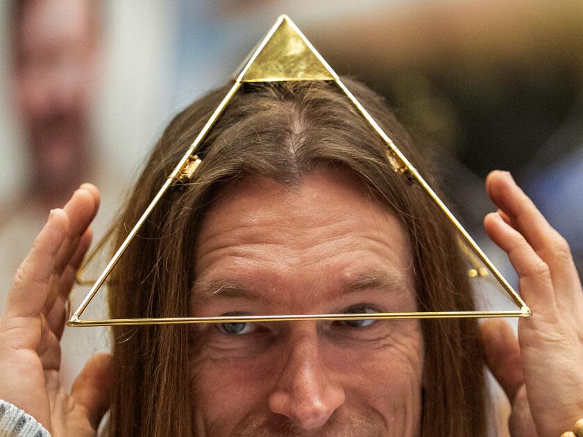 Bastian Trachte of Glendale wears a head pyramid used for meditation and healing.