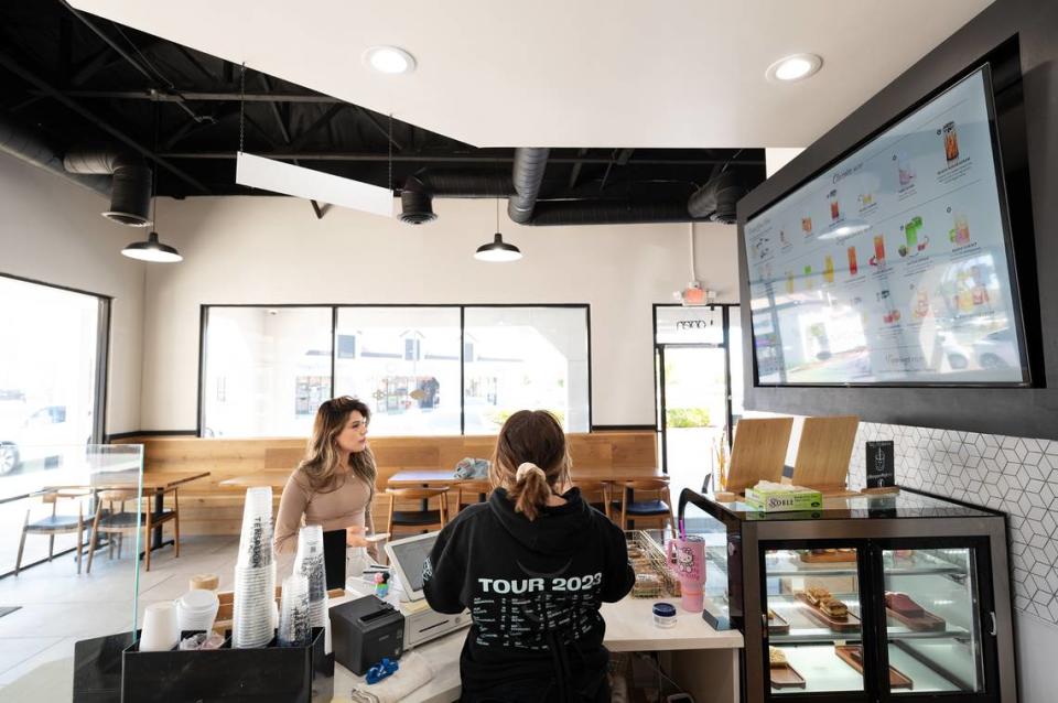 Wendy Montes orders a drink from barista Emma Goodwin at Teaspoon cafe in Modesto, Calif., Tuesday, April 9, 2024.