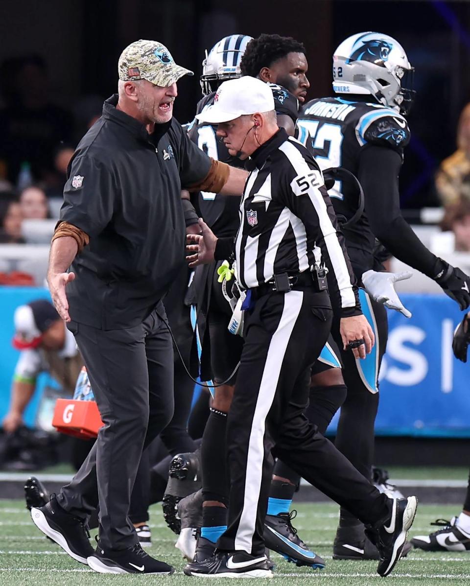 Carolina Panthers head coach Frank Reich, left, argues a call with an official during second-quarter action against the Indianapolis Colts on Sunday, November 5, 2023 at Bank of America Stadium in Charlotte, NC.