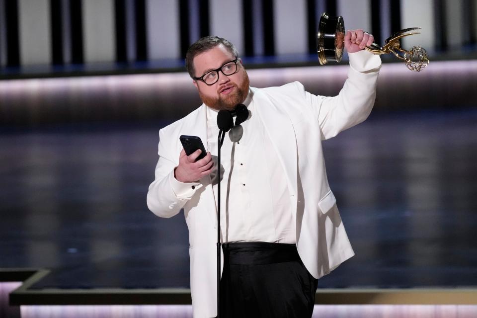 Paul Walter Hauser accepts the award for outstanding supporting actor in a limited or anthology series or movie during the 75th Emmy Awards at the Peacock Theater in Los Angeles on Monday, Jan. 15, 2024.