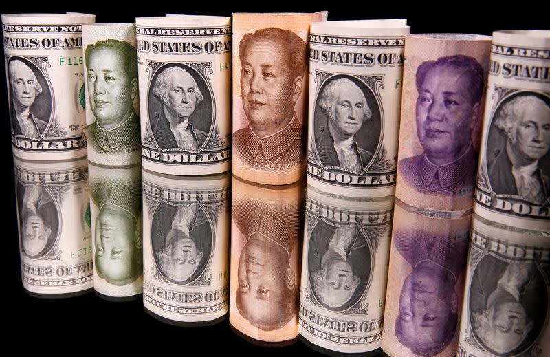 FILE PHOTO: Chinese Yuan and U.S. dollar banknotes are seen in this illustration