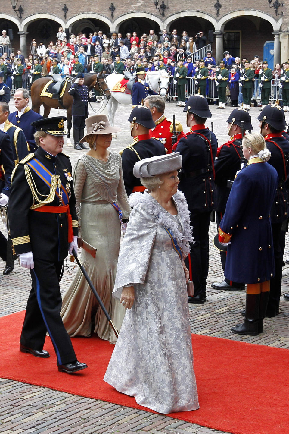 FILE - In this Sept. 20, 2011 file photo, Dutch Queen Beatrix, center, Crown Prince Willem-Alexander, left and Princess Maxima, second left, arrive at the "Hall of Knights" to formally open the new parliamentary year in The Hague, Netherlands. Queen Beatrix announced she is to abdicate in favor of Crown Prince Willem Alexander during a nationally televised speech Monday, Jan. 28, 2013. Beatrix, who turns 75 on Thursday, has ruled the nation of 16 million for more than 32 years and would be succeeded by her eldest son, Crown Prince Willem-Alexander. (AP Photo/Bas Czerwinski, File)