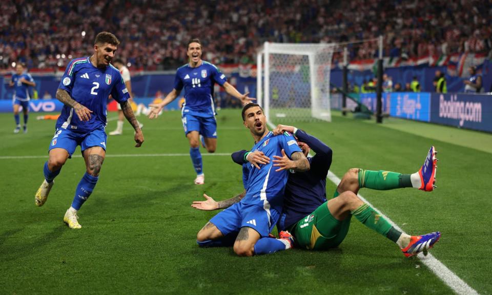 <span>Mattia Zaccagni (centre) celebrates after scoring Italy’s equaliser in the last minute of added time.</span><span>Photograph: Alex Pantling/Uefa/Getty Images</span>