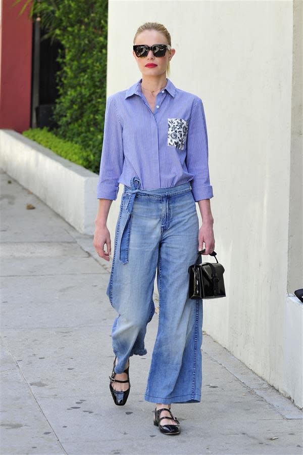 Kate Bosworth in a pair of denim culottes and a simple blue shirt.