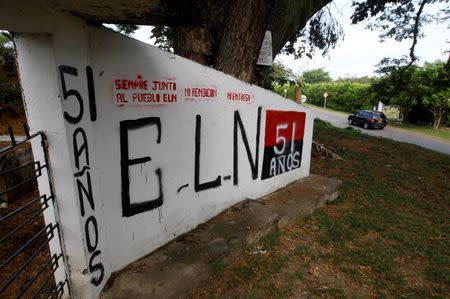 A graffiti, of rebel group Army Liberation National (ELN) is seen at the entrance of the cemetery of El Palo, Cauca, Colombia, February 10, 2016. REUTERS/Jaime Saldarriaga