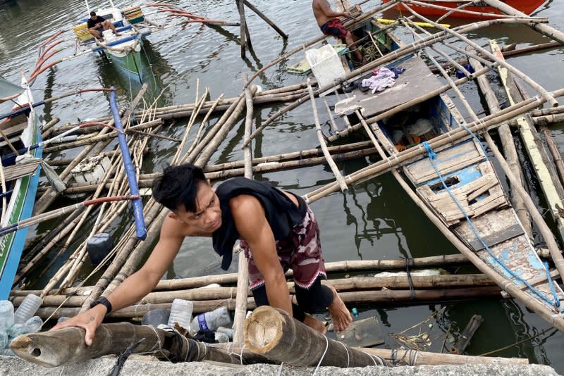 Fishermen secure boats in anticipation of an approaching typhoon in Las Pinas city, Metro Manila, Philippines, on July 25. File Photo by Francis R. Malasig/EPA-EFE