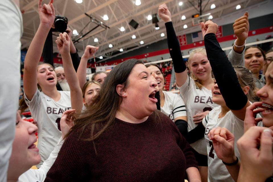 Beaver coach Susan Pollins celebrates with her team after winning the Class 2A WPIAL volleyball championship Saturday at Peters Township High School.