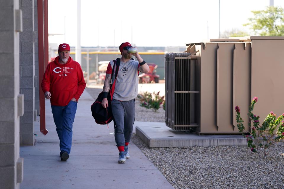 Marvin Fraley, left, walks with this son Jake back to the clubhouse during spring training workouts on Thursday.