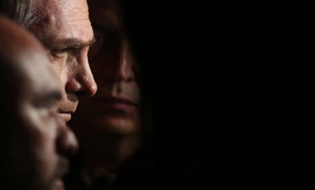 Presidential candidate Jair Bolsonaro talks to media after a visit to Federal Police headquarters in Rio de Janeiro, Brazil October 17, 2018. REUTERS/Ricardo Moraes