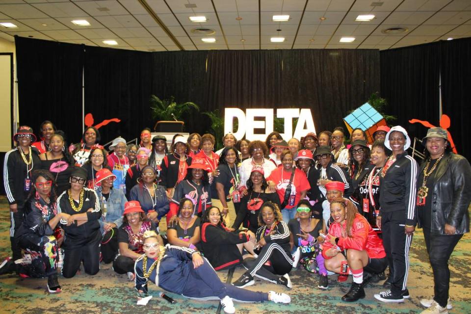 Members of Delta Sigma Theta, Inc. posed in outfits that matched the event’s ’90s throwback theme.