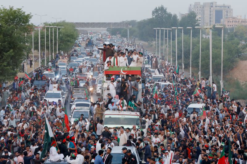 Ousted Pakistani Prime Minister Imran Khan gestures as he leads a protest march in Islamabad