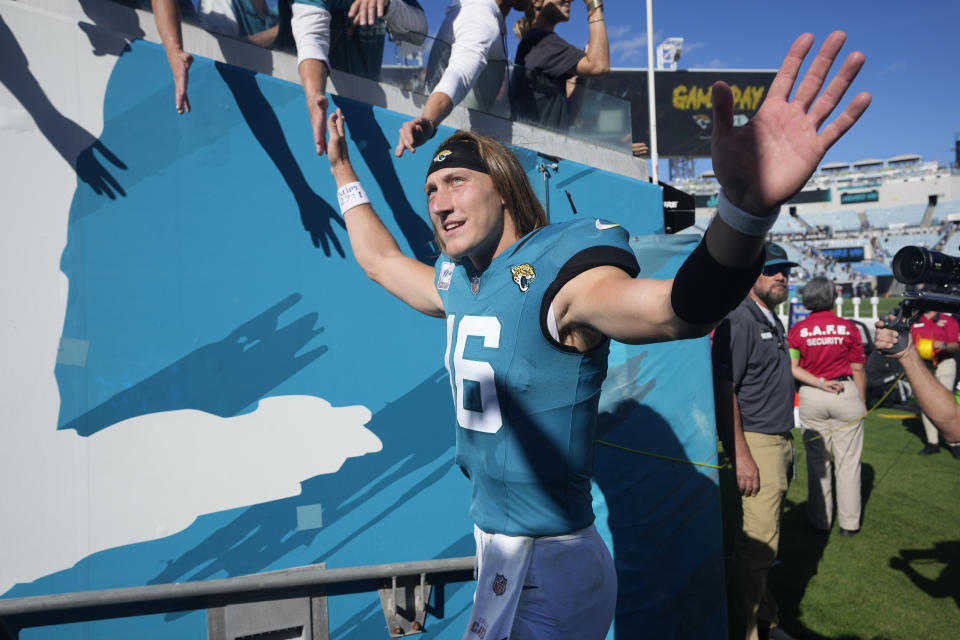 Jacksonville Jaguars quarterback Trevor Lawrence (16) waves to fans as he leaves the field after an NFL football game against the Indianapolis Colts, Sunday, Oct. 15, 2023, in Jacksonville, Fla. (AP Photo/John Raoux)