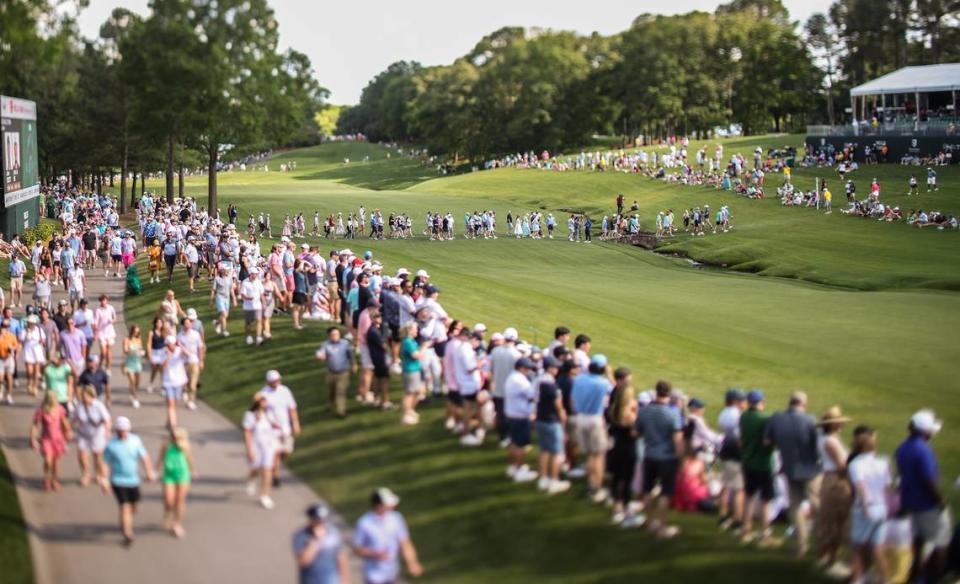 Spectators gather at the 18th hole during the third round of the 2023 Wells Fargo Championship in Charlotte, N.C., on Saturday, May 6, 2023.