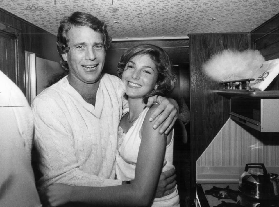 Ryan O'Neal hugs Tatum O'Neal on the set of her movie.