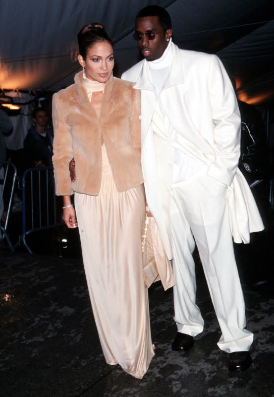 <p>Evan Agostini/Getty Images</p><p>Jennifer Lopez made her Met Gala debut in 1999—and back then, instead of the first Monday in May, it was held in December! With her all-white-clad then-beau <strong><a href="https://www.yahoo.com/lifestyle/why-were-diddys-la-homes-212930479.html" data-ylk="slk:Sean "Diddy" Combs;elm:context_link;itc:0;sec:content-canvas;outcm:mb_qualified_link;_E:mb_qualified_link;ct:story;" class="link  yahoo-link">Sean "Diddy" Combs</a></strong> on her arm, J.Lo rocked a nude gown with a chest cut-out under her tan fur jacket. The theme was "Rock Style," and while she could have grunged it up, we all know Lopez's style is clean, fresh and sexy—and check out her signature glowing skin.</p>