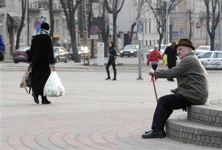 A man rests in Daugavpils March 21, 2014. REUTERS/Ints Kalnins