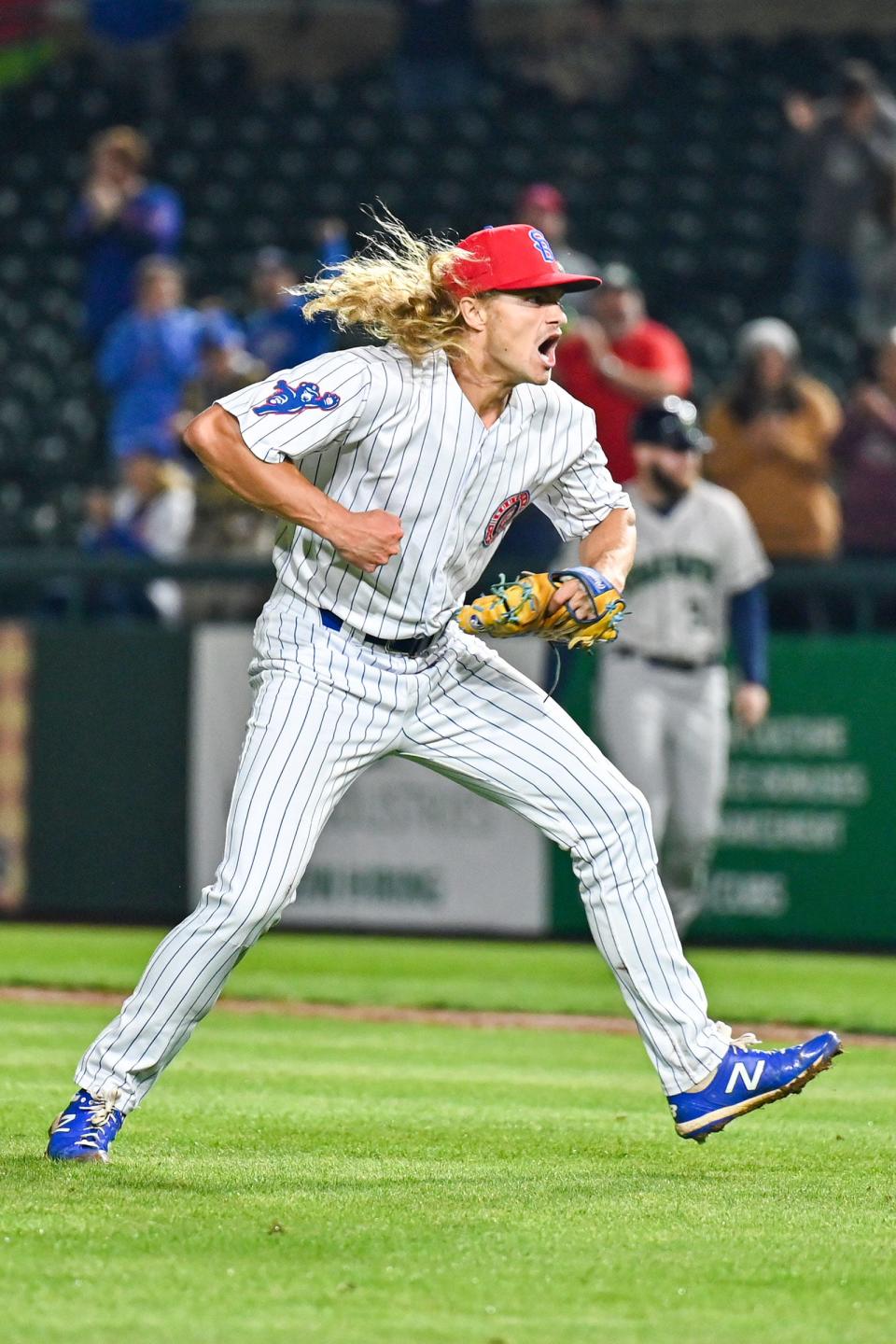 South Bend Cubs pitcher Jake Reindl (27) celebrates after striking out the final Cedar Rapids batter to seal the Cubs’ 2-1 win Tuesday, Sept. 13, 2022, at Four Winds Field.