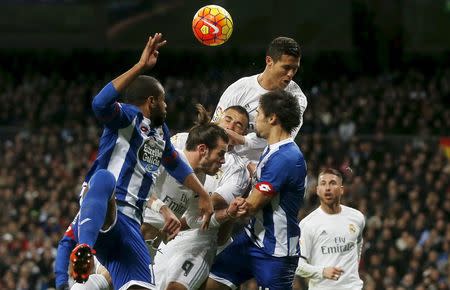 Football Soccer - Real Madrid v Deportivo Coruna - Spanish Liga BBVA - Santiago Bernabeu stadium, Madrid, Spain - 9/1/16 Real Madrid's Cristiano Ronaldo, Karim Benzema and Gareth Bale jump to head the ball with Deportivo Coruna's Sidnei Rechel da Silva Junior and Alejandro Arribas REUTERS/Susana Vera