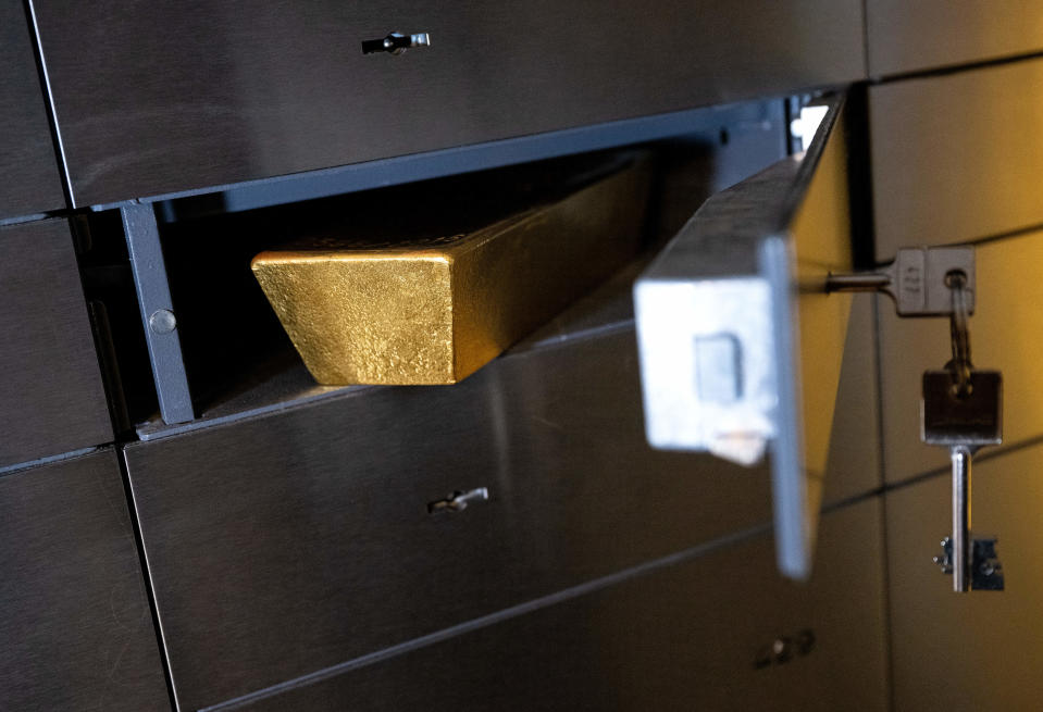 16 March 2023, Bavaria, Munich: At the precious metal dealer Pro Aurum, a gold bar is placed in a locker in a vault. Photo: Sven Hoppe/dpa (Photo by Sven Hoppe/picture alliance via Getty Images)