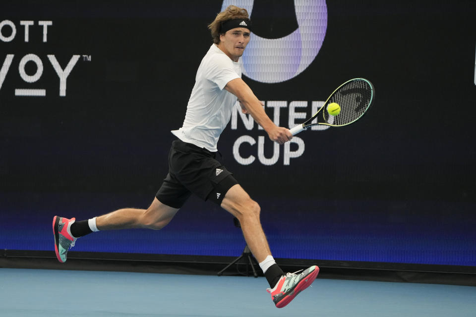 Germany's Alexander Zverev plays a backhand return to United States' Taylor Fritz during their Group C match at the United Cup tennis event in Sydney, Australia, Monday, Jan. 2, 2023. (AP Photo/Mark Baker)