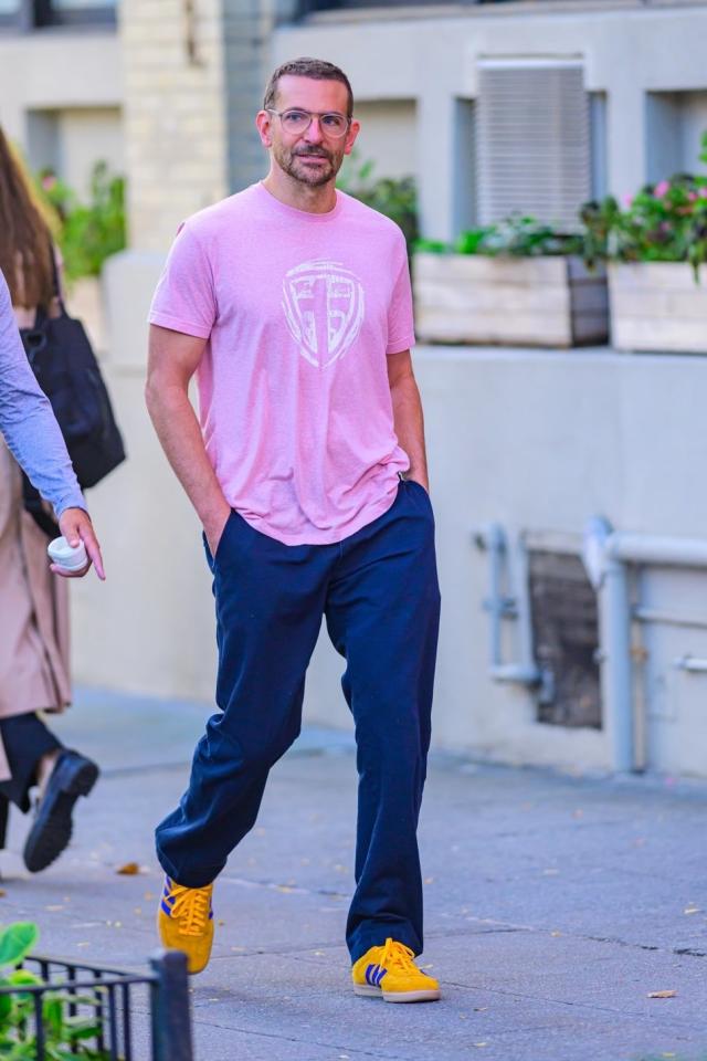 Gigi Hadid wearing a pink outfit as she returns to her apartment in New  York City