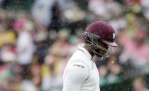 West Indies batsman Marlon Samuels spits out his chewing gum as he walks off the pitch after being run out during the third cricket test against Australia at the SCG in Sydney, January 3, 2016. REUTERS/Jason Reed