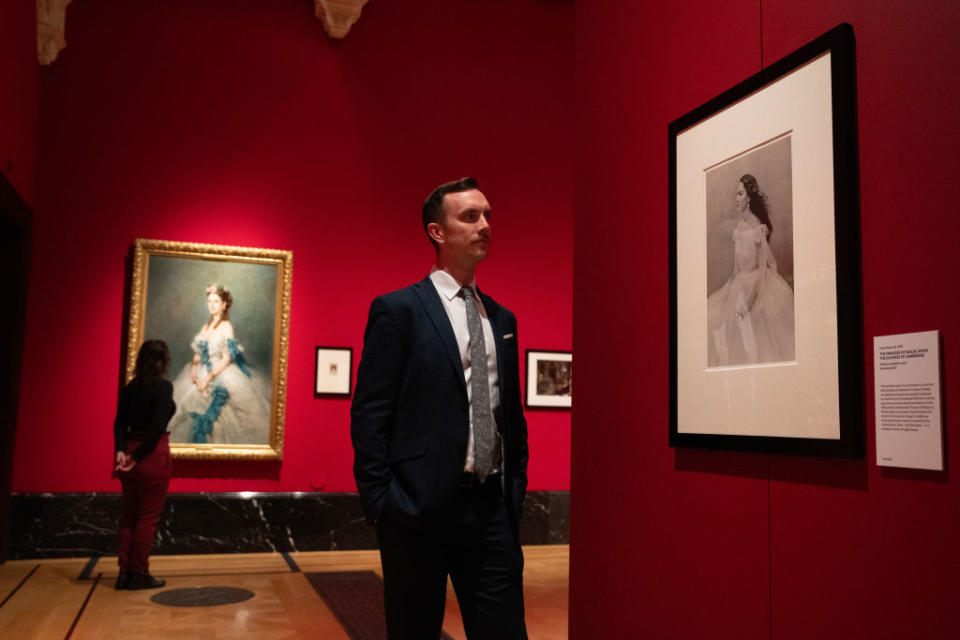 A photograph of Kate Middleton, captured by Paolo Roversi, is on display across from a 1864 painting of Alexandria, then-Princess of Wales, by Franz Xaver Winterhalter.<span class="copyright">Carl Court—Getty Images</span>