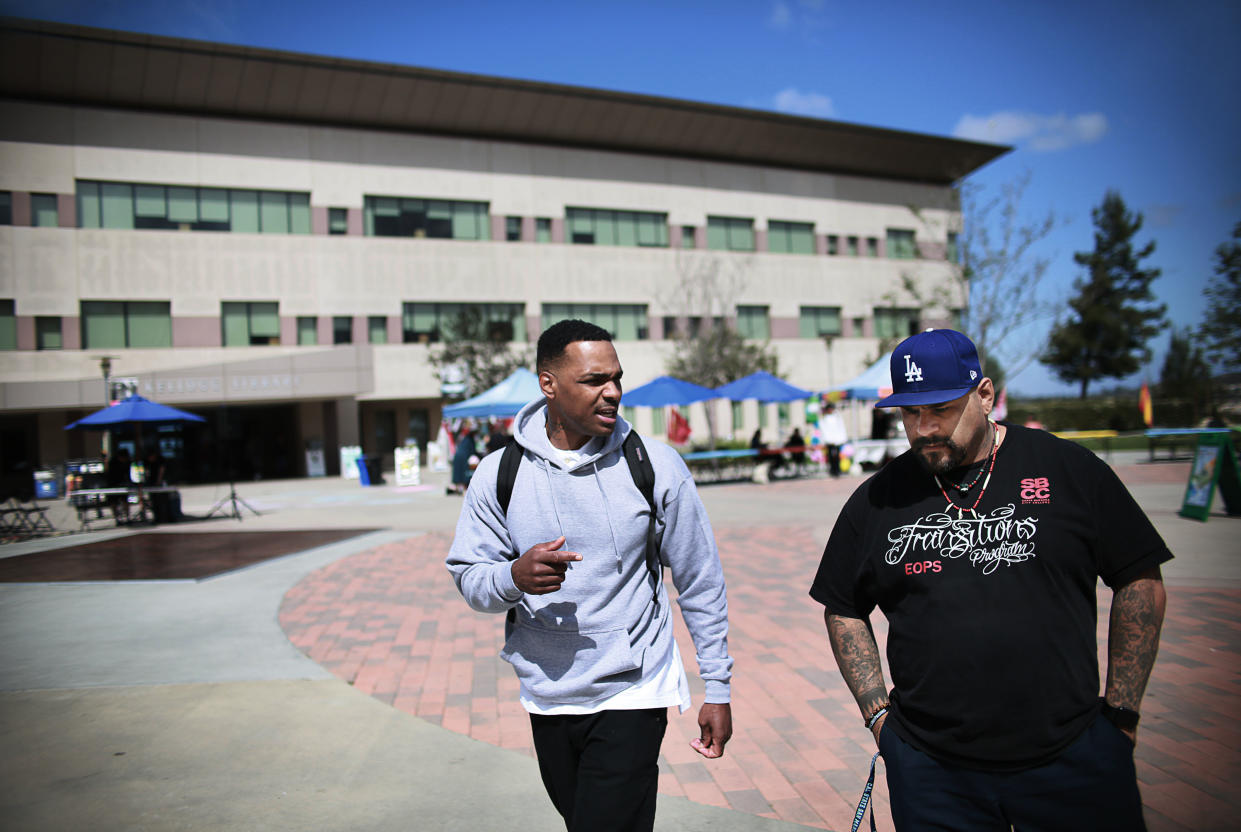 Tim Jackson and Martin Leyva, both formerly incarcerated students, walk across the Cal State San Marcos campus on Thursday, April 12, 2018. Jackson said that education helped open his eyes to the truth and a better life: “Truth is the most powerful reality on this side of existence and I have come to learn that education manifests truth.” (Photo: Sandy Huffaker for Yahoo News)