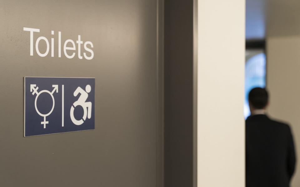 A symbol indicates a gender neutral toilet in the Congress Center, prior to the 50th annual meeting of the World Economic Forum - ALESSANDRO DELLA VALLE/EPA-EFE/REX /REX