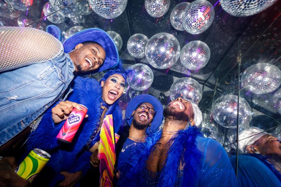 members of the Sissy Stroll at a bar in WeHo