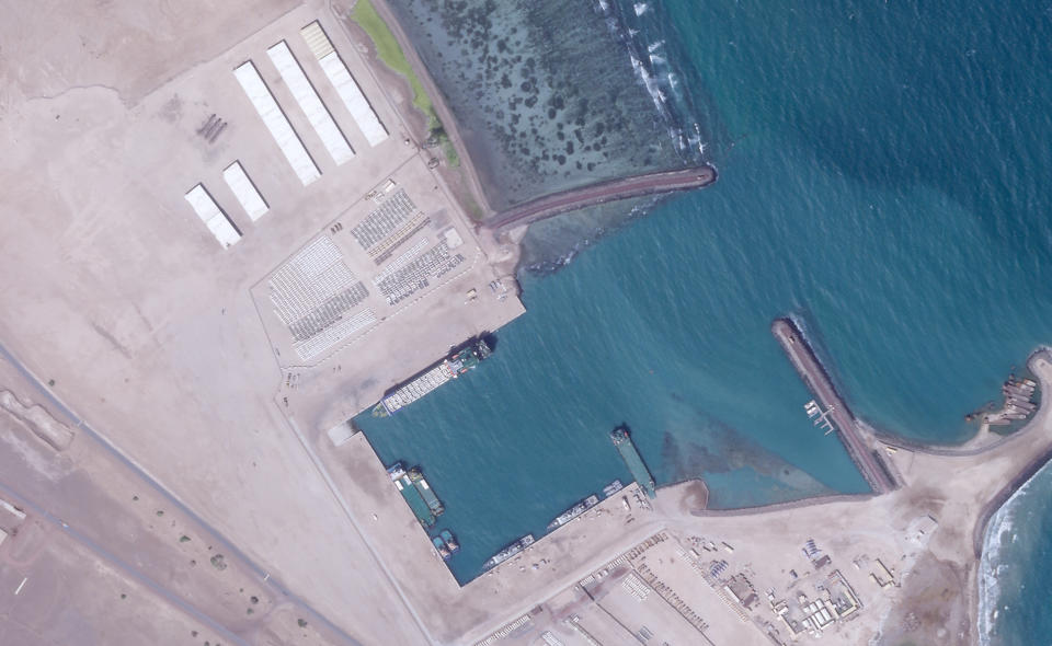 A Jan. 7, 2021, satellite photo from Planet Labs Inc. shows what appears to be vehicles and other material being loaded onto a ship at a port at an Emirati military base in Assab, Eritrea. The United Arab Emirates is dismantling parts of a military base it runs in the East African nation of Eritrea after it pulled back from the grinding war in nearby Yemen, satellite photos analyzed by The Associated Press show. (Planet Labs Inc. via AP)