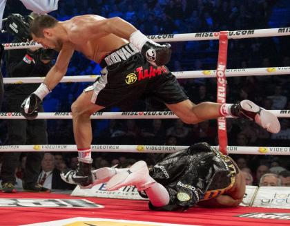 Sergey Kovalev leaps over Ismayl Sillakh after knocking him out in November. (AP)