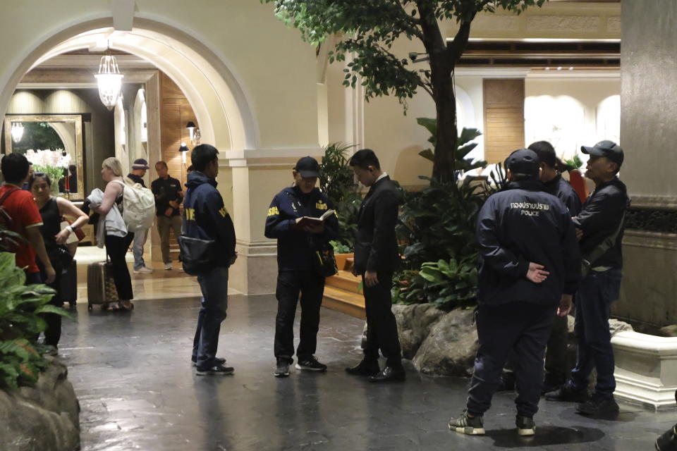 Police gather outside the Grand Hyatt Erawan Hotel in Bangkok, Thailand, Tuesday, July 16, 2024. Police said a number of people were found dead Tuesday in the luxury hotel in downtown Bangkok and poisoning is suspected. (AP Photo/Chatkla Samnaingjam)