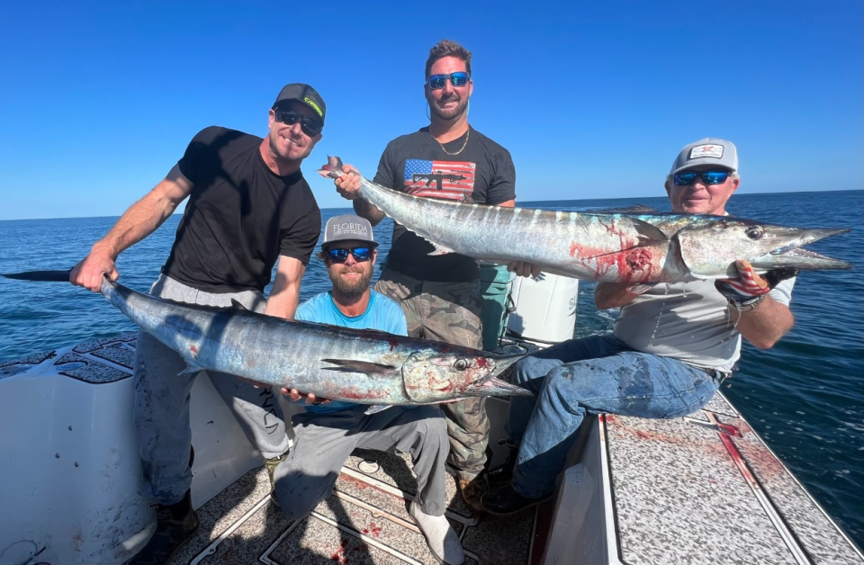 Myles Newton, Jeff Patterson, Callahan Hood and Scott Laney with two of four wahoo they caught during a midweek offshore run.