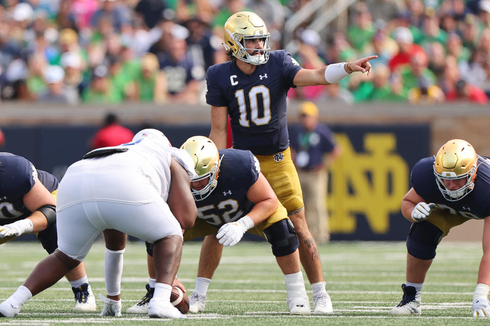 SOUTH BEND, INDIANA – SEPTEMBER 02: Sam Hartman #10 of the Notre Dame Fighting Irish directs the offense against the Tennessee State Tigers during the first half at Notre Dame Stadium on September 02, 2023 in South Bend, Indiana. (Photo by Michael Reaves/Getty Images)