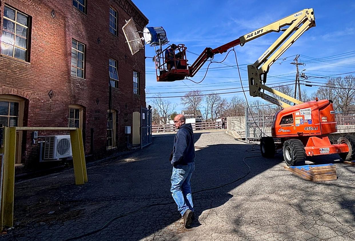 A portable light was lifted into place on Tuesday, April 9, 2024, for an interior shot inside a building at the former Reed & Barton complex in Taunton where an episode of "The Walking Dead: Dead City" was filmed.