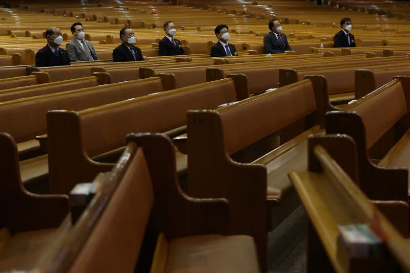 Christian faithfuls wearing masks to prevent contacting the coronavirus sit during a service at a church in Seoul