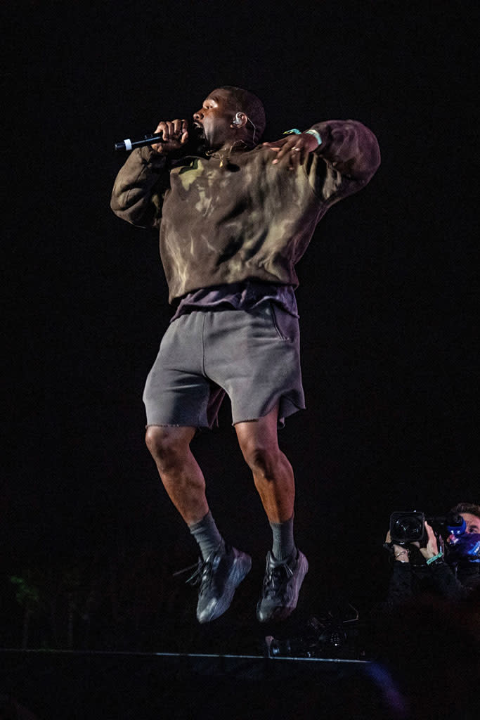 Kanye West jumps up and down onstage at Coachella. - Credit: Shutterstock