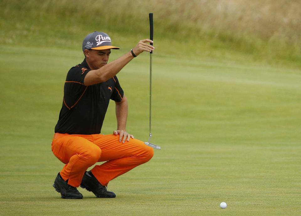 Rickie Fowler of the U.S. lines up his putt on the first green during the final round of the British Open golf championship on the Old Course in St. Andrews, Scotland, July 20, 2015. REUTERS/Phil Noble