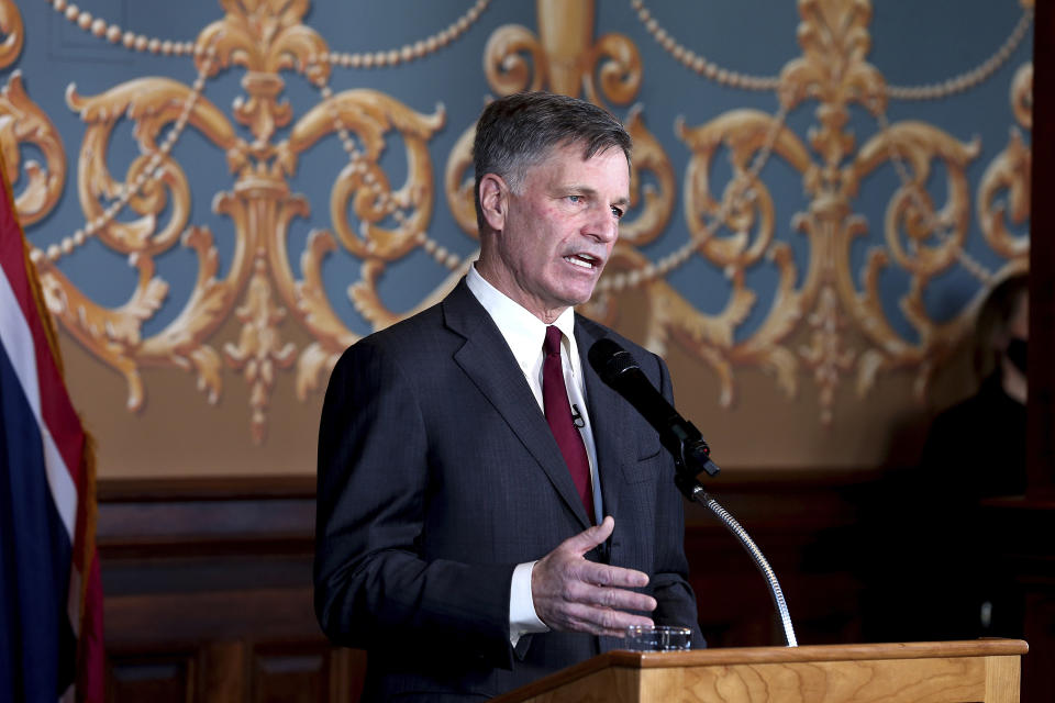 FILE - In this March 2, 2021 file photo Wyoming Gov. Mark Gordon gives the State of the State address to the 66th Wyoming Legislature, inside the state Capitol. A law signed April 6, 2021, by Republican Gov. Gordon creates a $1.2 million fund for an initiative that marks the latest attempt by state leaders to help coal in the state that accounts for the bulk of U.S. coal production, which is down by half since 2008. Wyoming coal production, which accounts for about 40% of the nation's total, has declined as utilities switch to gas, which is cheaper to burn to generate electricity. Solar and wind power also are on the rise as coal's share of the U.S. power market shrinks from about half in the early 2000s to less than 20% now. (Michael Cummo/Wyoming Tribune Eagle via AP, File)