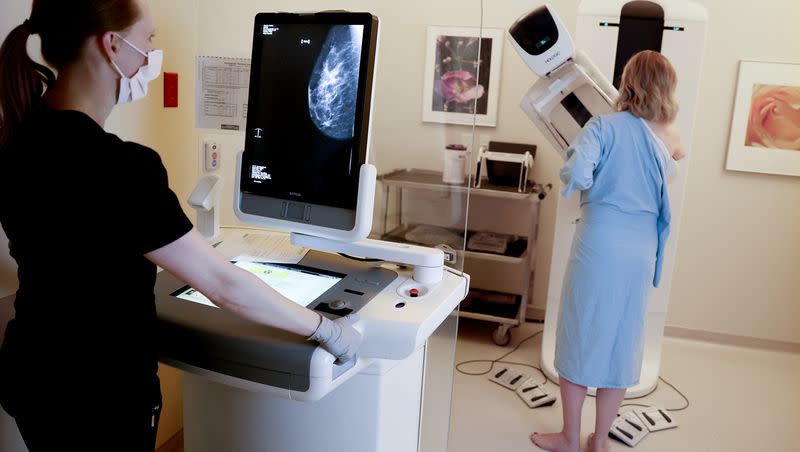 Registered radiologic technologist Holly Speer performs a mammogram on Heather Simonsen at the Huntsman Cancer Hospital in Salt Lake City on April 7, 2023.